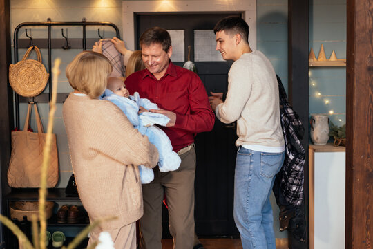 Family with cute baby at home for New Year celebration