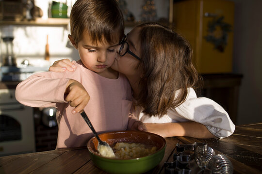 Brother and sister baking together 