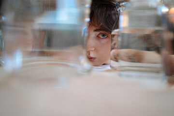 close-up women between water bottles