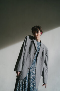 Skinny woman in oversize jacket in city
