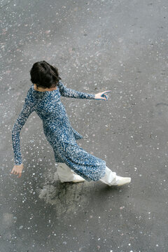 stylish woman walking on asphalt