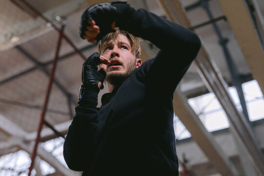 Wrestler fighting bout and waiting for punches 