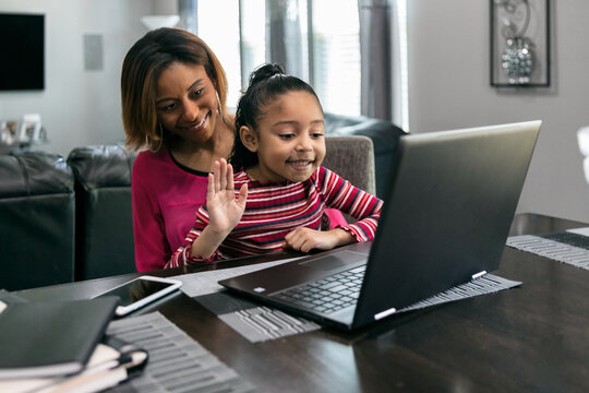Home: Little Waves To Someone During Video Call