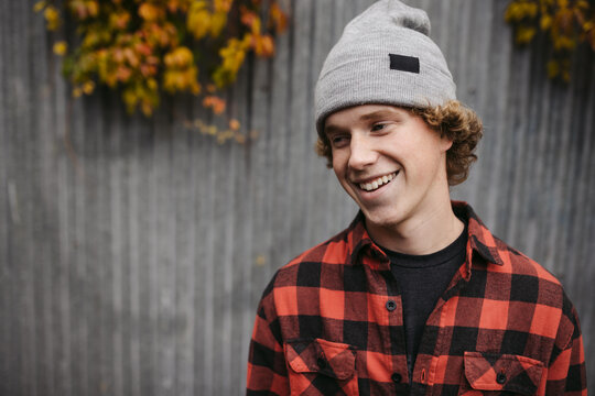 Smiling teenage boy outside