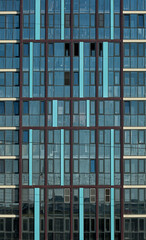 Obraz premium Facade of a multi-storey building, glazed wall, skyscraper windows