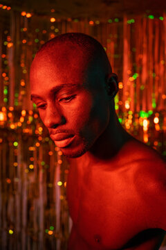 Red Portrait Of A Black Man With Golden Background.