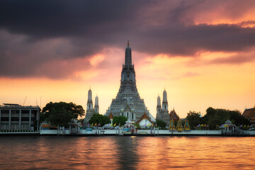 Wat Arun Temple or Temple of dawn at night with Chao Praya River in Bangkok, Thailand