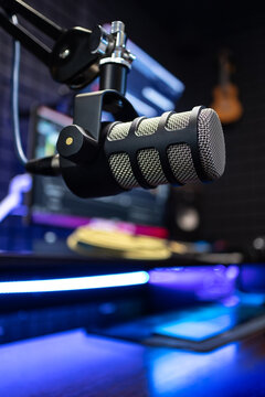 Professional studio condenser microphone in modern music recording studio on a sound acoustical foam background in recording studio