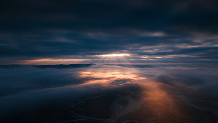 dramatic sunset above frozen river