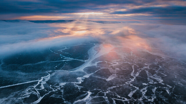 dramatic sunset above frozen river - Powered by Adobe