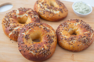 freshly baked whole grain bagels. heap of fresh baked bagels