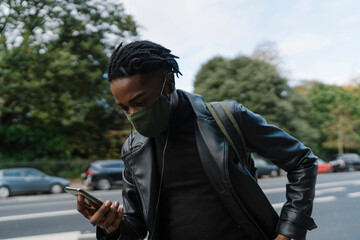 Man With Face Mask and mobile phone