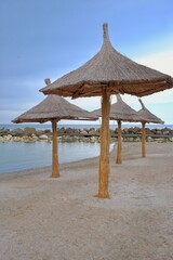 Beach with umbrellas on the shores of the Black Sea.  The ideal place to relax and spend wonderful moments.