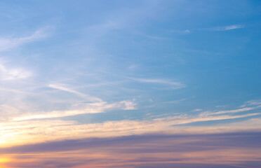 Beautiful Vivid sky painted by the sun leaving bright golden shades.Dense clouds in twilight sky in winter evening.Image of cloud sky on evening time.Evening Vivid sky with clouds.