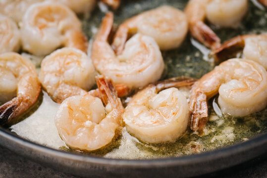 Shrimp frying in a garlic butter sauce