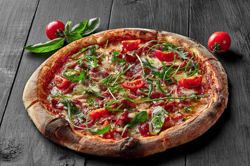 Pizza with pelati sauce, cabanossi, salami, bacon, ham