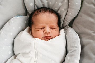 new born baby in rocker