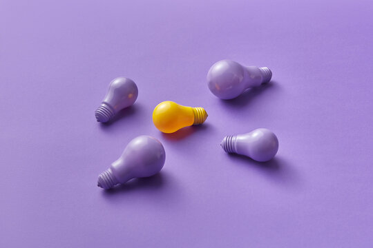 Yellow and violet light bulbs