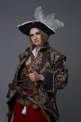 Fototapeta premium Woman corsair captain with hat and handgun