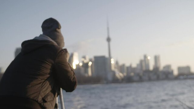 Photographer taking photo of Toronto skyline in background 2