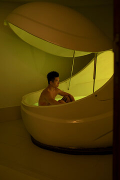 Asian man floating