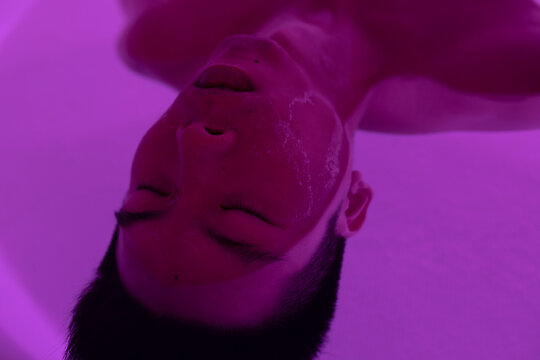 Asian man floating