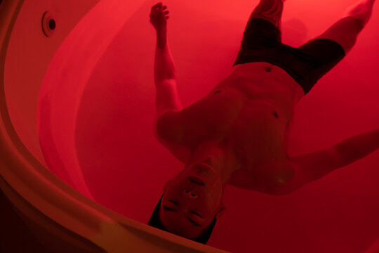 Asian man floating