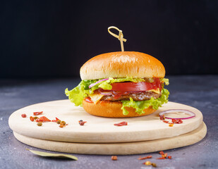 Simple hamburger on a light wooden board