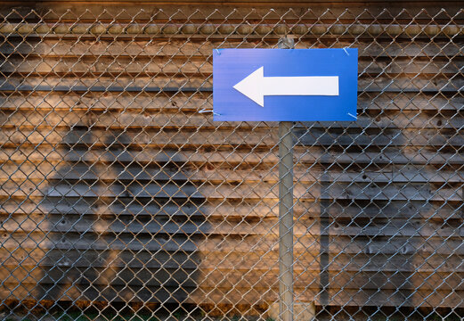 Arrow and Shadows of Walking People