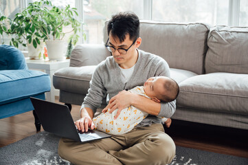 father and baby at home