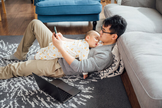 father and baby at home