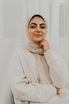 Middle Eastern Woman In Front of Window