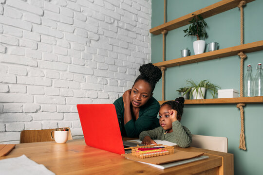 A Woman and Her Little Girl at Home