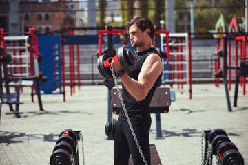 Healthy bearded man having cross-fit training outdoors