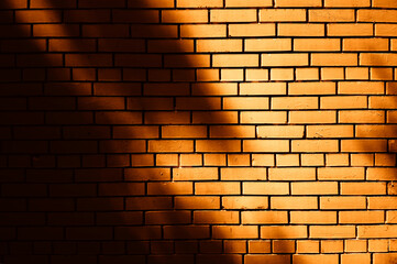 Fototapeta na wymiar Shadows on brick wall texture background