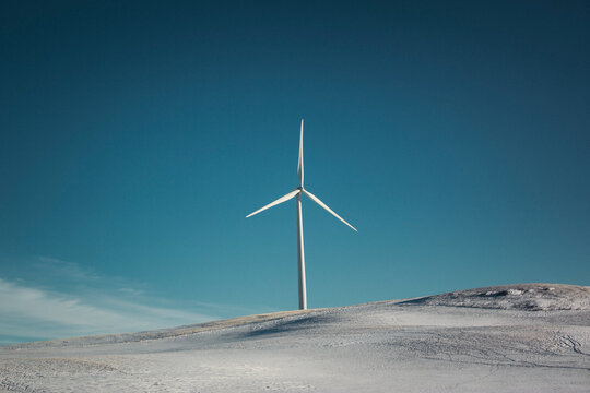Windmills on the prairies during winter.