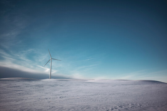 Windmills on the prairies during winter.