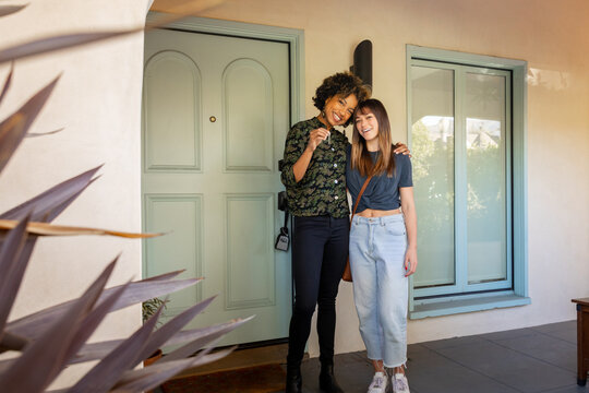 Couple Smiles With Their New Home Keys