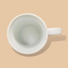 empty cup of coffee on cream background