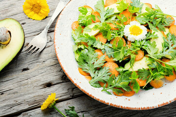 Diet salad with chrysanthemum leaves and avocado