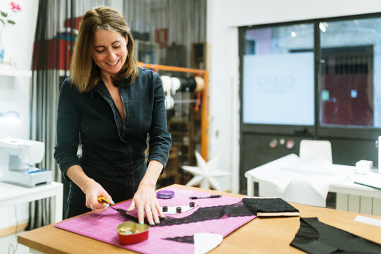 Woman cutting lace fabric