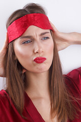 Young woman with red lips, with mask for sleep, young lady pouting