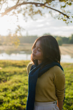 Asian lady in meadow