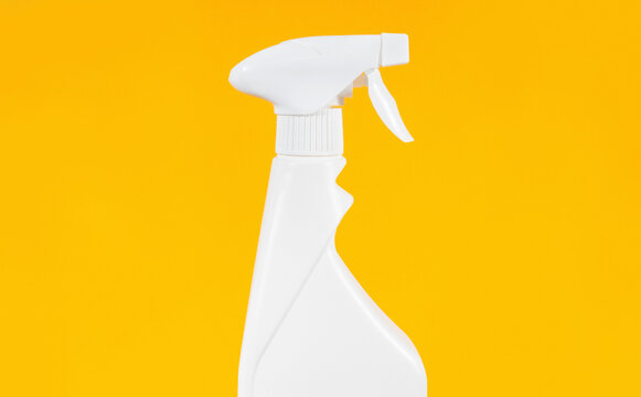 Spray bottle on yellow