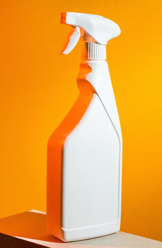 Spray bottle on yellow