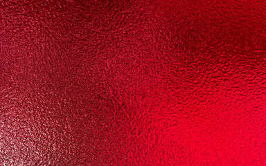 Red shiny foil metallic paper texture background. Use for christmas and valentine day concept.
