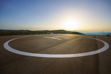 Empty helipad on top of a peak in a country side remote location