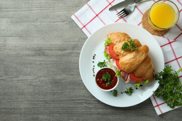 Concept of tasty eating with croissant sandwich, space for text