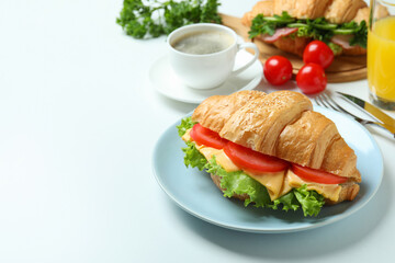 Concept of tasty eating with croissant sandwich, space for text