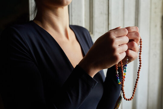 Woman doing a prayer.